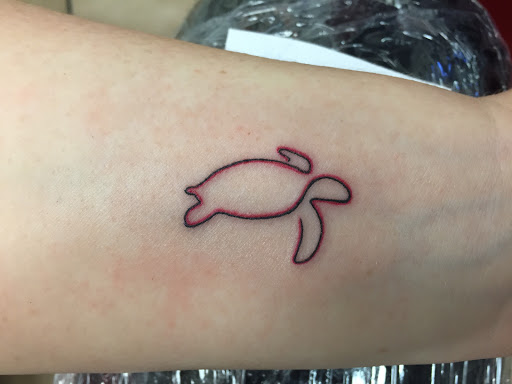 Find dragon arm tattoo ideas for your next unique tattoo in Tampa at Angel Tattoo