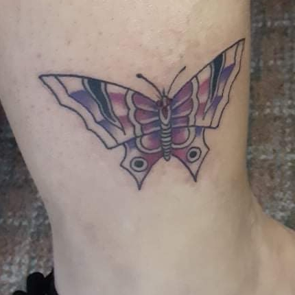 Explore nose tattoo ideas, creative tattoo ideas in Angola, available at Hoodlum Ink