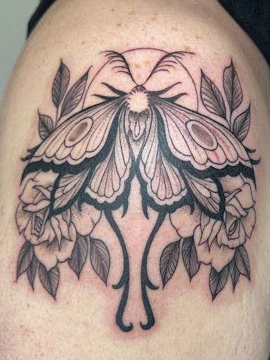 Explore tribal wolf tattoo ideas, creative tattoo ideas in Fort Wayne, available at Attraction Tattoos