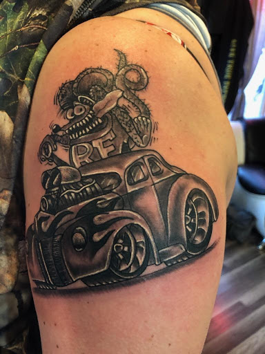 Explore feather tattoo ideas for men, creative tattoo ideas in Dry Ridge, available at Live True Tattoo