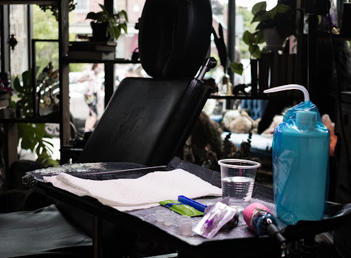 Find tattoo ideas between breast for your next unique tattoo in Buffalo at True Gloom Tattoo Studio