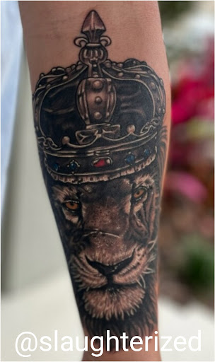 Explore ripped tattoo ideas, creative tattoo ideas in Ocoee, available at Slaughterized Ink Tattoo and Piercing Studio