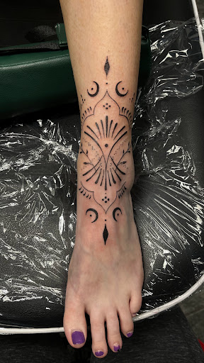 Explore garter tattoo ideas, creative tattoo ideas in Harrah, available at Gypsy Blood Body Art Studio