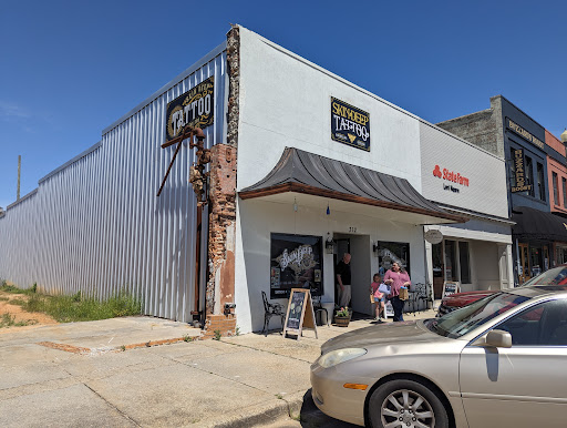 Explore leg tattoo cover up ideas for men, creative tattoo ideas in Laurel, available at Skin Deep Tattoo Studio