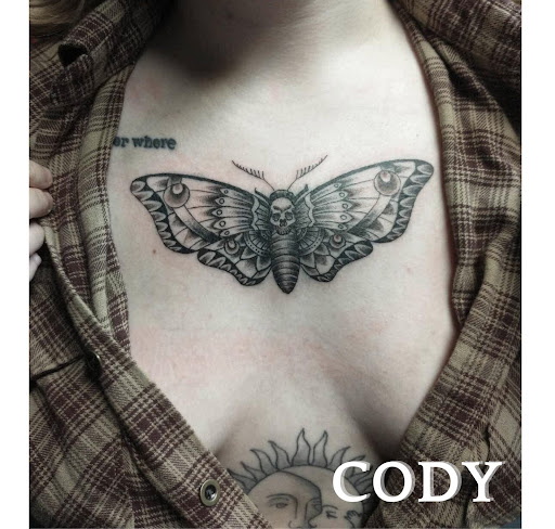 Explore red bird tattoo ideas, creative tattoo ideas in Benton, available at Relics Tattoo Studio