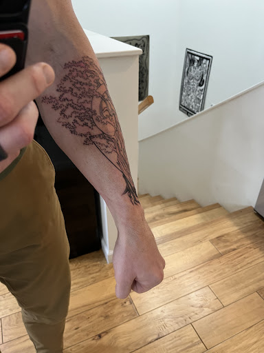 Explore tattoo flag ideas, creative tattoo ideas in Magnolia, available at Mr. Grays Tattoo Studio