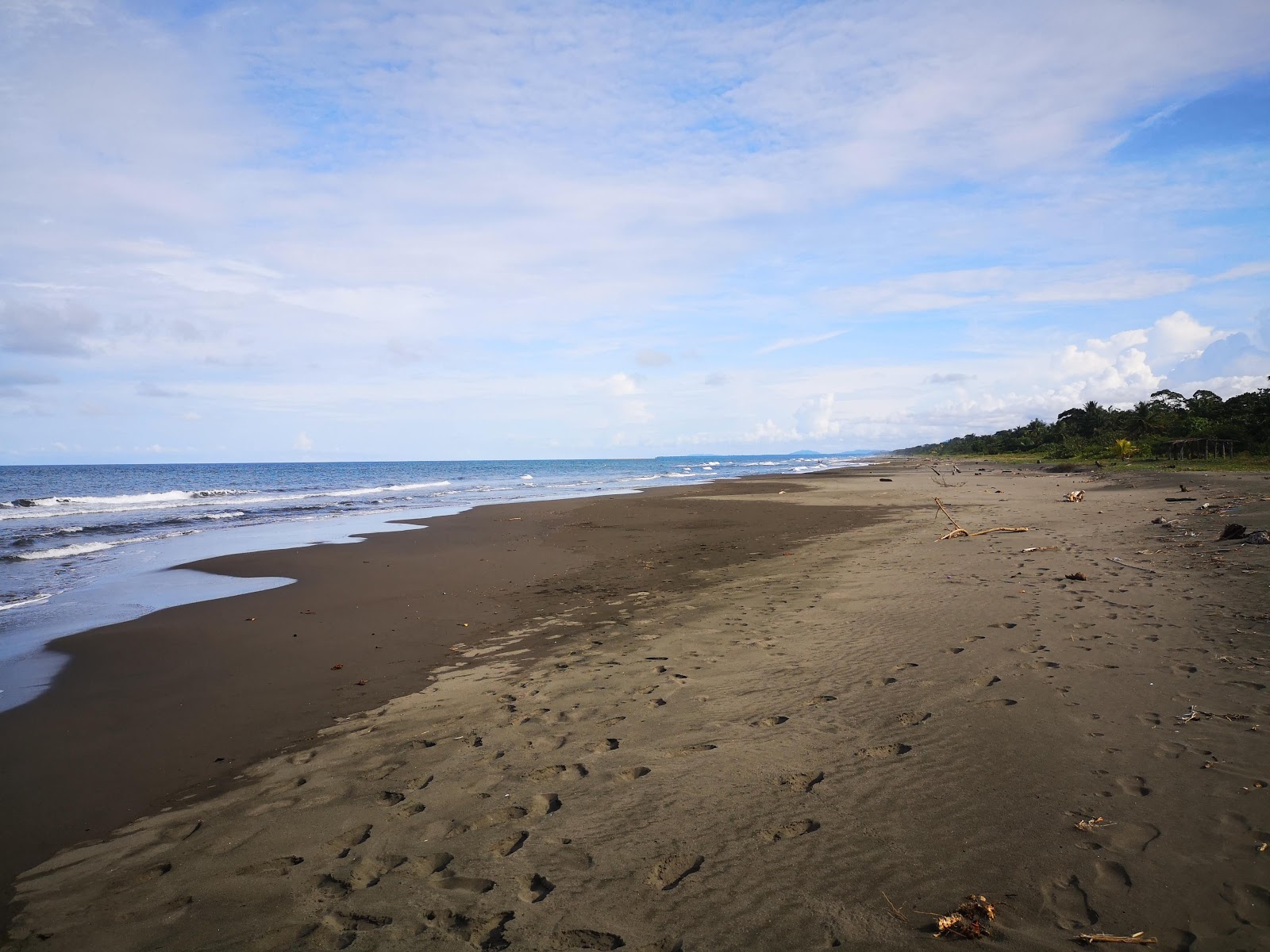 Foto van Palmeras beach met recht en lang