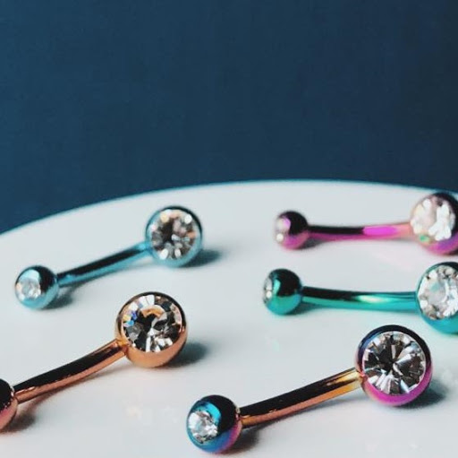 Find small sun tattoo ideas for your next unique tattoo in Saint Cloud at Almost Famous Body Piercing