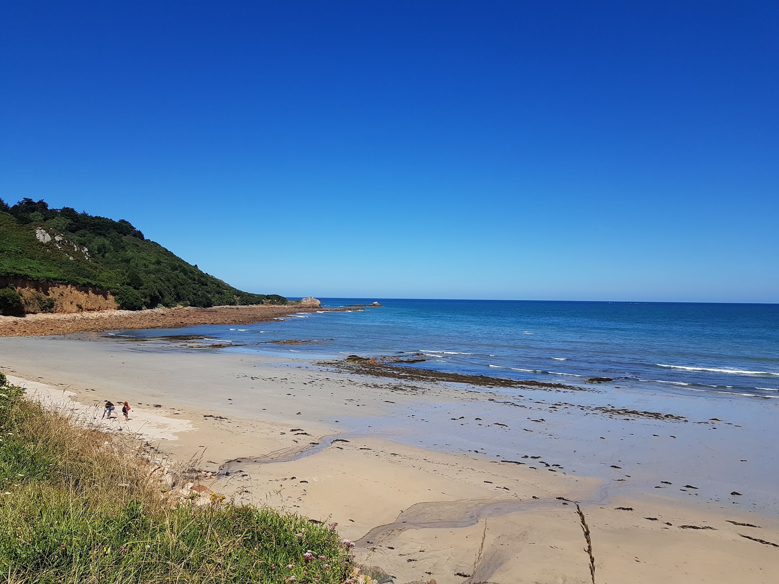 Foto di Plage de Poul Rodou con una superficie del sabbia beige