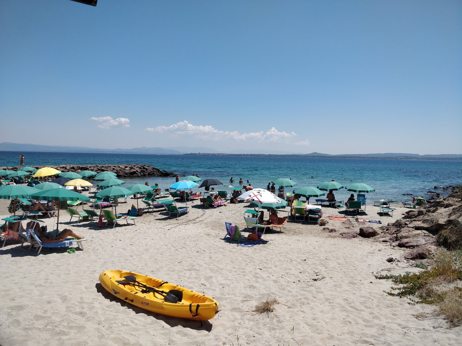 Foto av Punta Nera beach med turkos rent vatten yta
