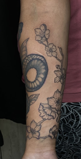 Explore matching ghost tattoo ideas, creative tattoo ideas in Cadillac, available at Limitless Ink Tattoo Studio