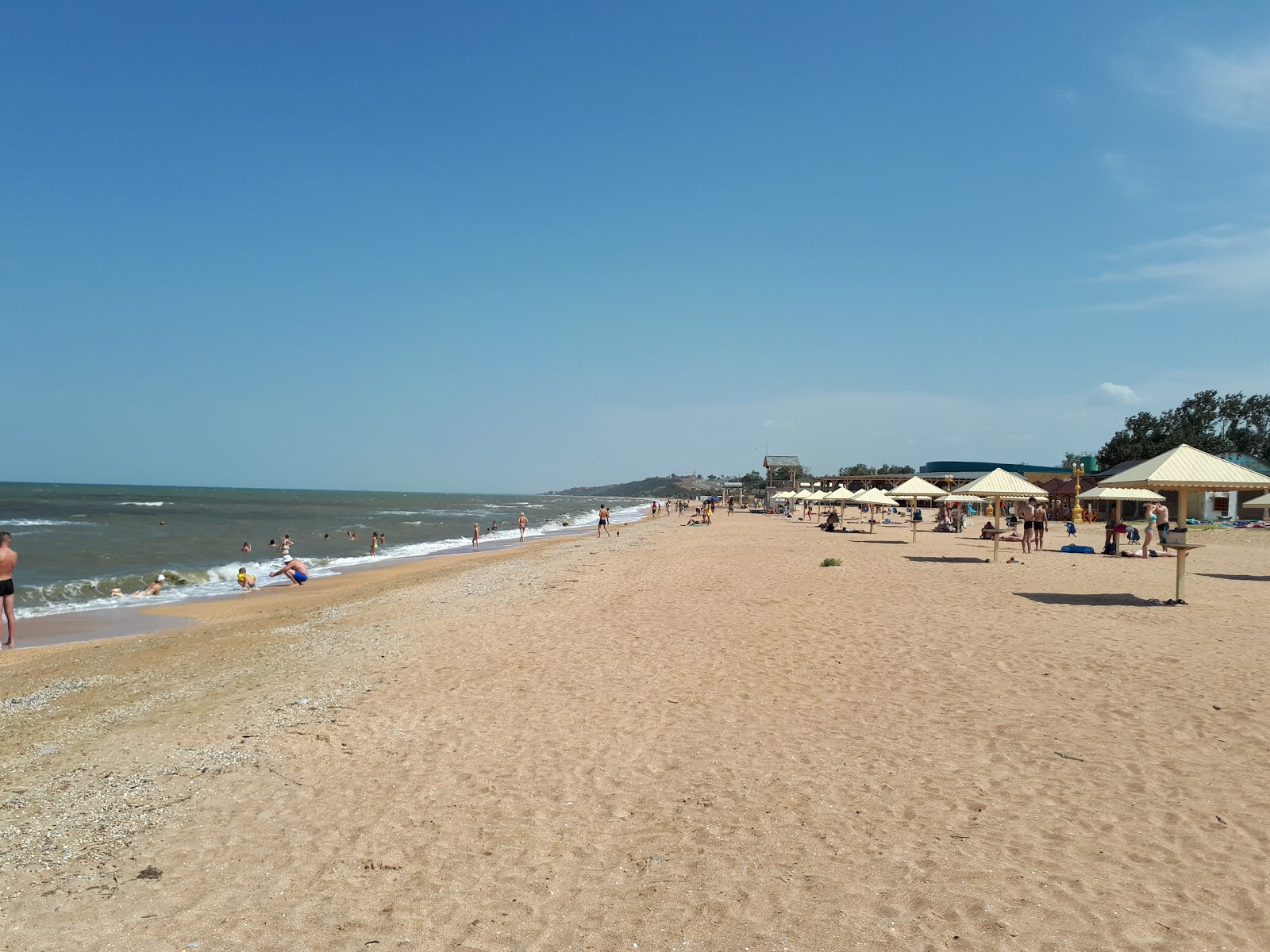 Foto van Poseidon Plyazh met bruin zand oppervlakte