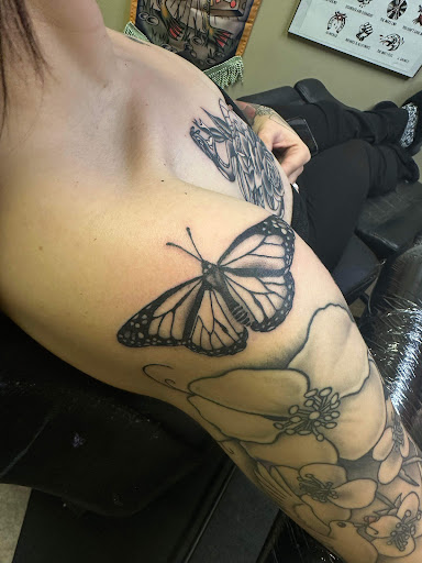 Explore black tattoo ideas for women, creative tattoo ideas in Nashville, available at RedBird Tattoo