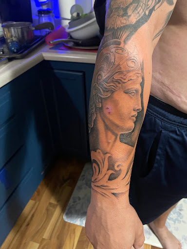 Explore lion sleeve tattoo ideas, creative tattoo ideas in Fort Wayne, available at InkoFriendly Tattoos
