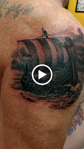 Explore atom tattoo ideas, creative tattoo ideas in Marietta, available at Monkeys Uncle Tattoo