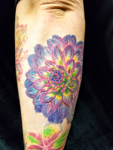 Explore tan tattoo ideas, creative tattoo ideas in Elkhart, available at Juicy Tattoo and Piercing
