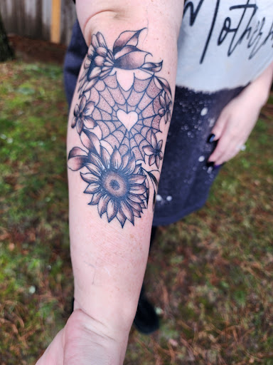 Explore ear tattoo ideas for women, creative tattoo ideas in Puyallup, available at Get Right Studios