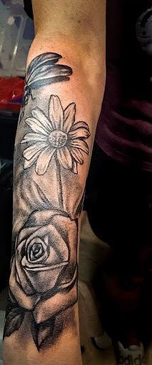 Explore back of ear tattoo ideas, creative tattoo ideas in Navasota, available at Big Mikes Tattoos
