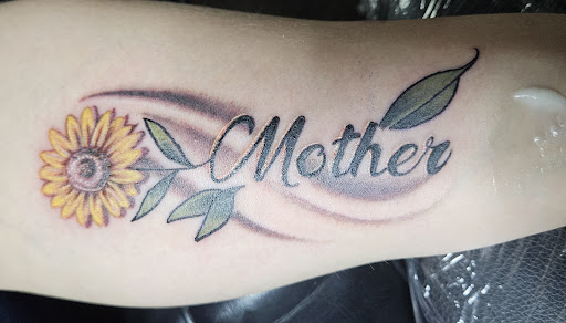 Explore tattoo face ideas, creative tattoo ideas in Angola, available at Hoodlum Ink