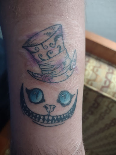 Explore black couple tattoo ideas, creative tattoo ideas in Cornelia, available at Prismatic Pulse Tattoo