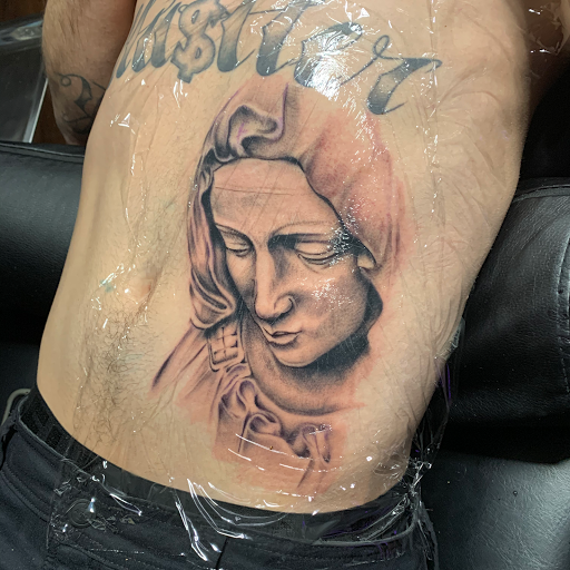 Explore sewing tattoo ideas, creative tattoo ideas in Roscoe, available at Elevated Ink Tattoo