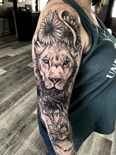 Explore kiss band tattoo ideas, creative tattoo ideas in Gadsden, available at Sacred Art Tattoo Company