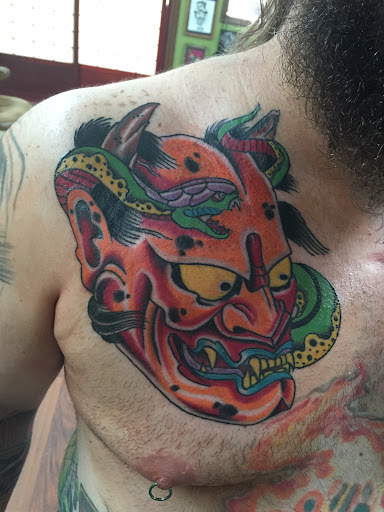 Explore flower spine tattoo ideas, creative tattoo ideas in Sioux City, available at 712 Tattoo