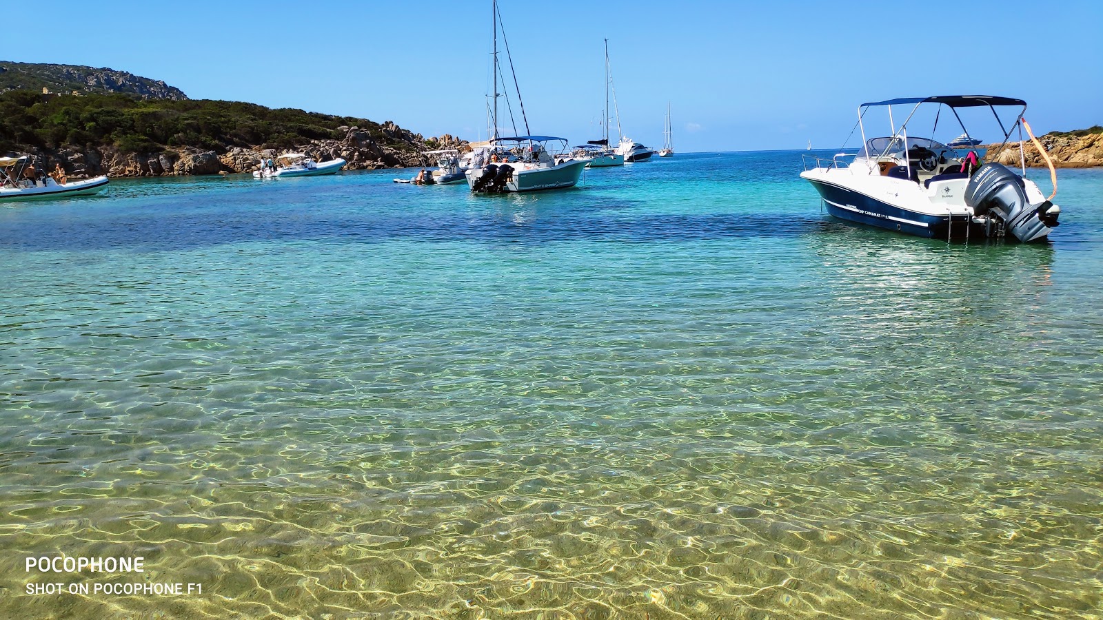 Photo of Cala di Conca with turquoise pure water surface