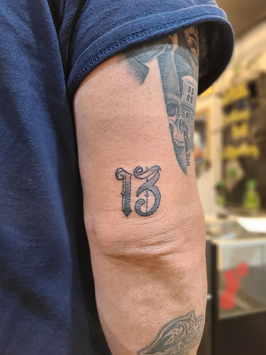 Explore mens upper back tattoo ideas, creative tattoo ideas in Newburgh, available at Outlaw Ink