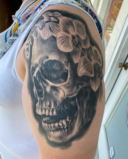 Explore women's leg tattoo ideas, creative tattoo ideas in High Ridge, available at Diablo Ink Tattoos