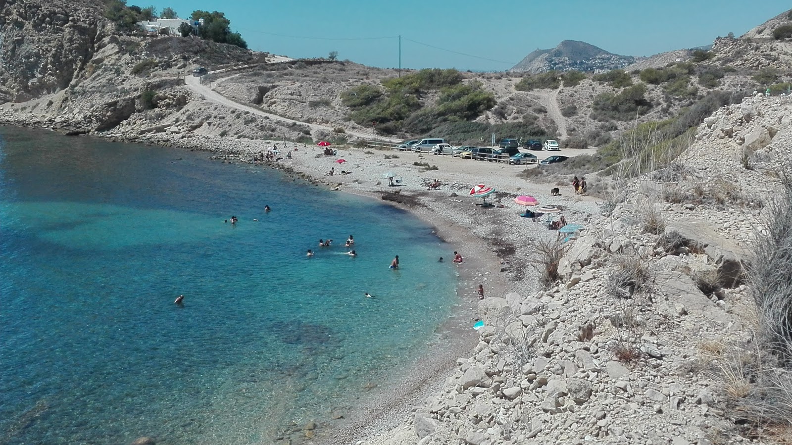 Photo of Cala el Charco with gray pebble surface