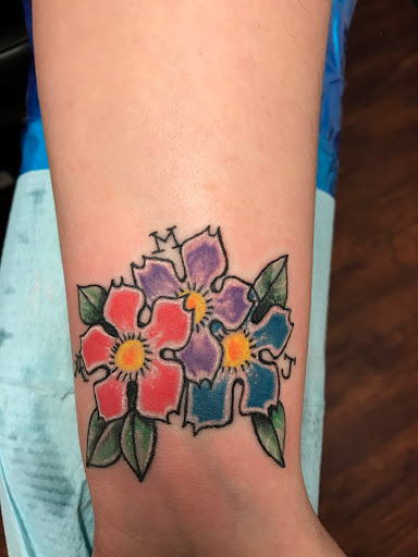 Explore rose tattoo idea, creative tattoo ideas in Seymour, available at American Gypsy Tattoo Corp.