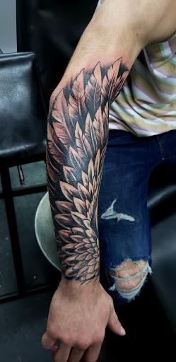 Explore men's rib tattoo ideas, creative tattoo ideas in Columbia City, available at Ink Spot Tattoo