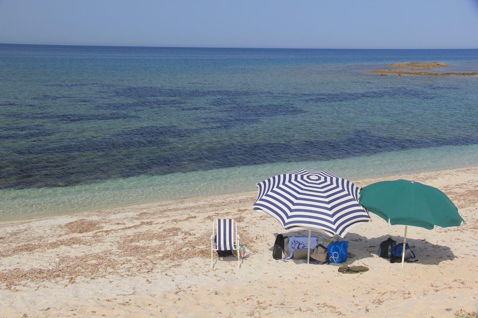 Foto van Caogheddas beach met turquoise puur water oppervlakte
