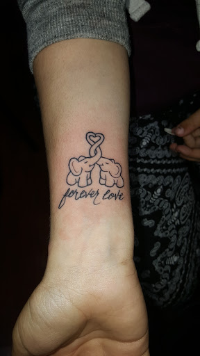 Find tattoo ideas snake for your next unique tattoo in Roseville at Fallen Angel Tattoo