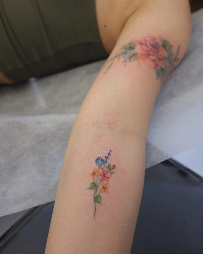 Explore 2x2 tattoo size ideas, creative tattoo ideas in Orange, available at Baron Art Tattoo