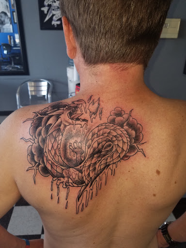 Find tattoo ideas with roses for your next unique tattoo in Tucson at Empire Tattoo