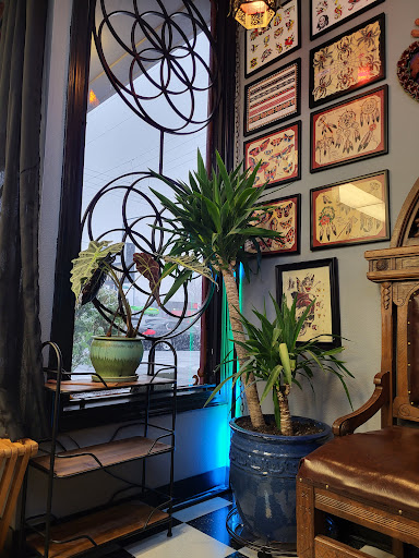 Explore cute face tattoo ideas, creative tattoo ideas in Olympia, available at Lo and Behold Tattoo