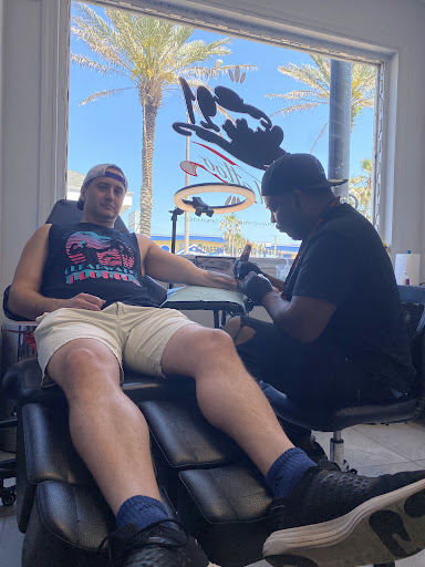 Explore joker hand tattoo ideas, creative tattoo ideas in Daytona Beach, available at Studio 21 Tattoo & Piercings Daytona Beach