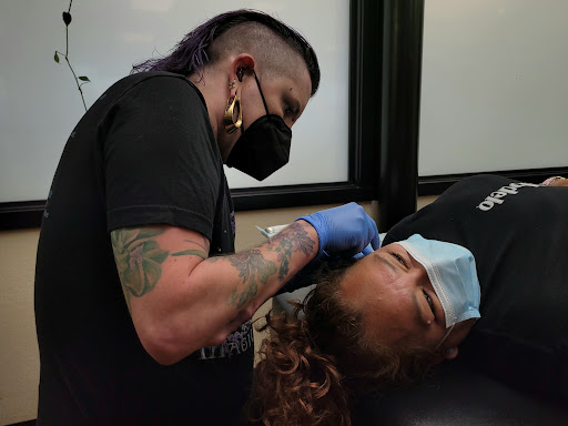 Explore tattoo ideas for book lovers, creative tattoo ideas in Salem, available at High Priestess Piercing & Tattoo