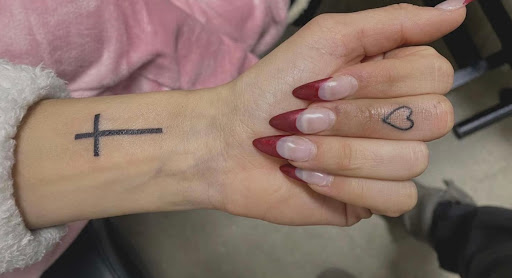 Explore cross tattoo ideas for females, creative tattoo ideas in Peru, available at Irezumi Tattoo Parlor