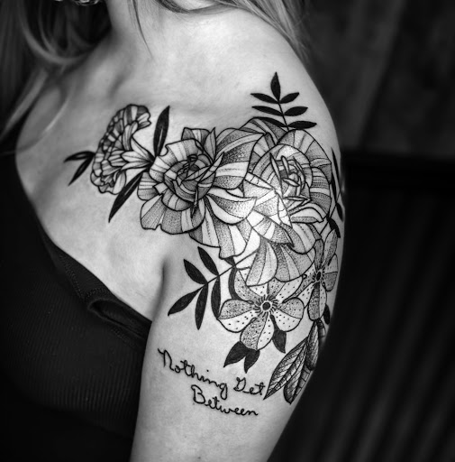 Explore spartan helmet tattoo ideas, creative tattoo ideas in Elkview, available at Andy Electric Tattoos