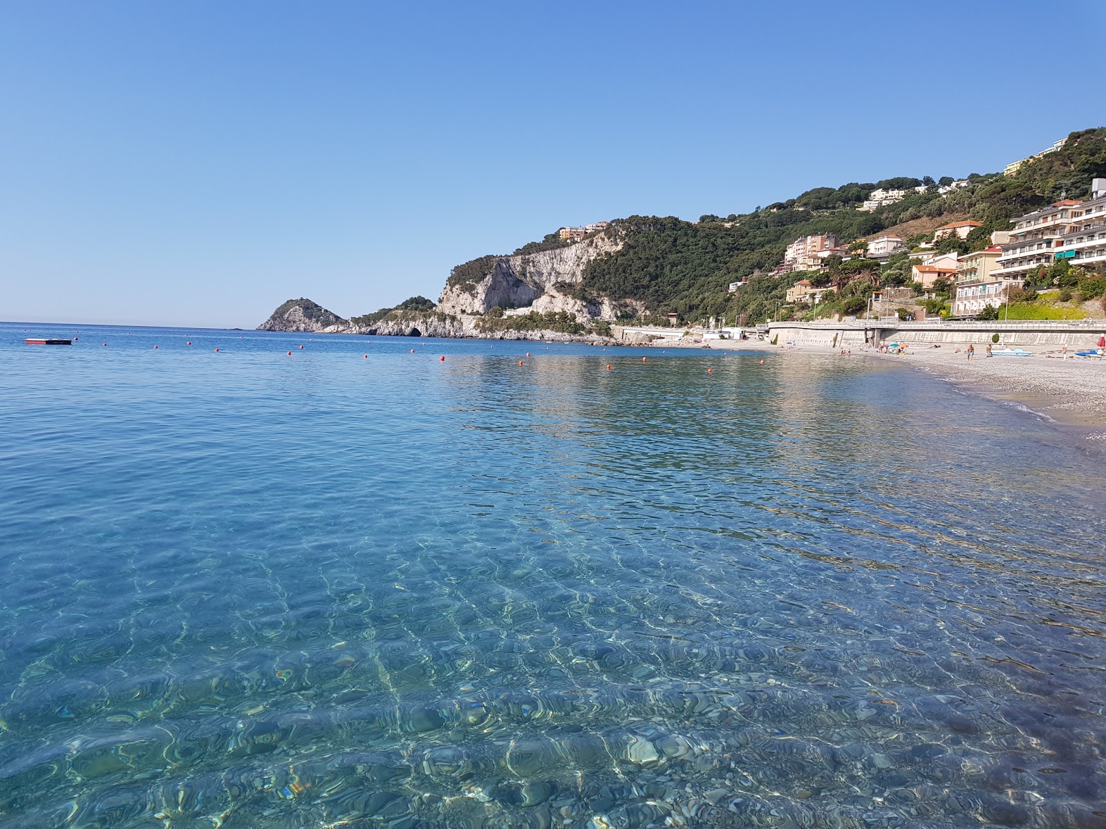 Photo of Bergeggi Beach with brown fine pebble surface