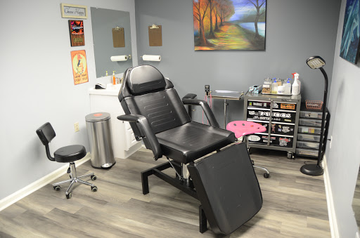 Explore belly button tattoo ideas, creative tattoo ideas in Greenfield, available at Tattoos In Time Studio