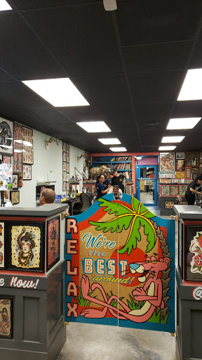 Explore carnage tattoo ideas, creative tattoo ideas in Orange, available at Black Palm Tattoo