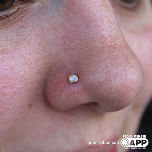 Explore throat tattoo ideas for men, creative tattoo ideas in Fort Myers, available at Tiger Lotus Tattoo and Piercing