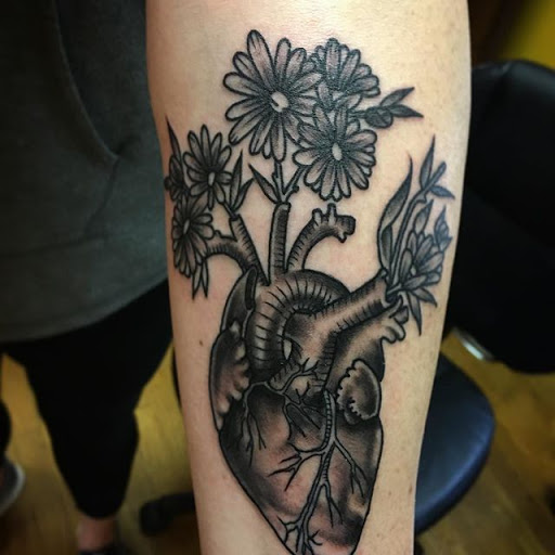 Explore men's back shoulder tattoo ideas, creative tattoo ideas in Columbia, available at Living Canvas Tattoo & Body Piercing