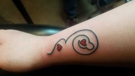 Explore bow and arrow tattoo ideas, creative tattoo ideas in Minneapolis, available at Leviticus Tattoo and Body Piercing