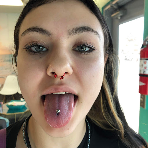 Explore lily flower tattoo ideas, creative tattoo ideas in Nampa, available at Hippie Hoops and Holes