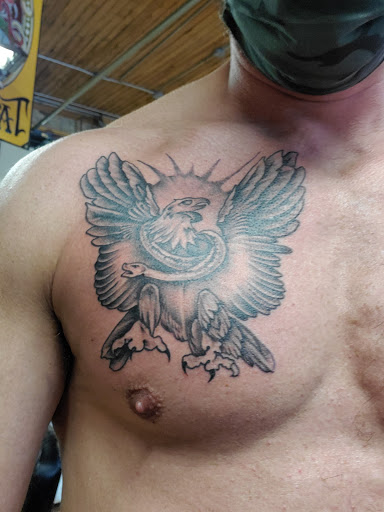 Explore mountain bike tattoo ideas, creative tattoo ideas in Milwaukee, available at Mike Davenport Tattoo